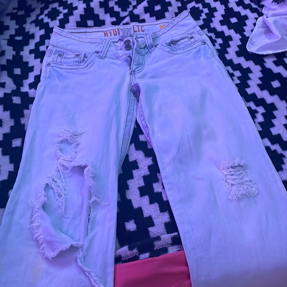 These pants are light blue Jean bootcut with holes